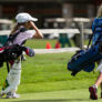 Nike Junior Golf Camps walking on green png
