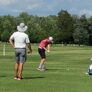 Coaches watch driving range session at college showcase