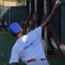 Nike Baseball camper pitching to catcher in the bullpen