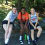 Lewis Clark College girls smiling and making friends at youth basketball camp in oregon