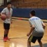Saint Anselm College youth boys doing one on one basketball scrimmage