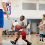 St. Ignatius Basketball camp showing a camper driving to the hoop