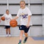 Girl dribbling at half court