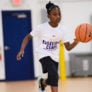 Girl looking up toward basket