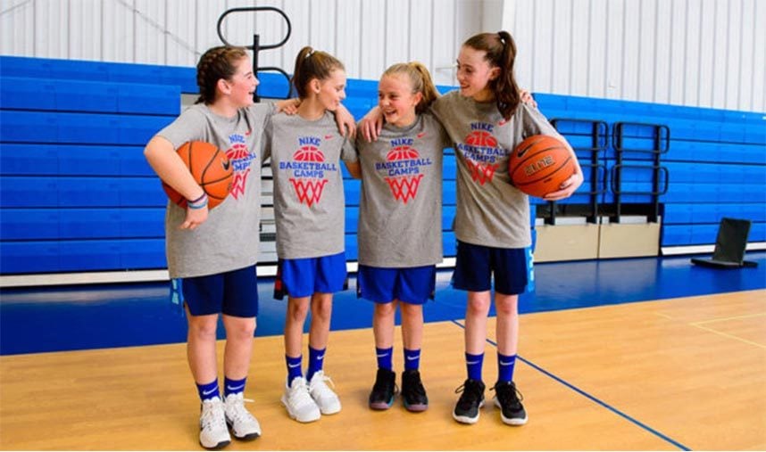 Teammates at a basketball youth camp having serious fun!