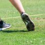 Nike Junior Golf Camp tee shot close up grass flying