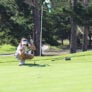 Nike Junior Golf Camp lining up putt png