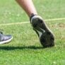 Nike Junior Golf Camp tee shot close up grass flying png