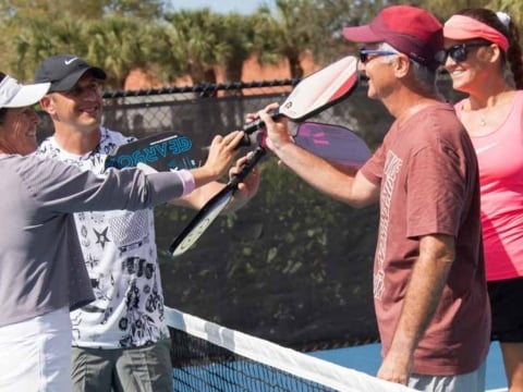 Photoshoot 2 pickleball group paddles in