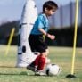 Young Boy kicking ball