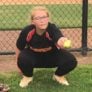 Camper squatting down for catcher specific drills