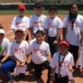 Campers and coach pose on the infield of Hutton Field for camp picture