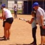 Coaches help campers with bunting technique
