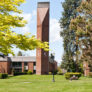 Clock tower on grassy field on George Fox University Campus